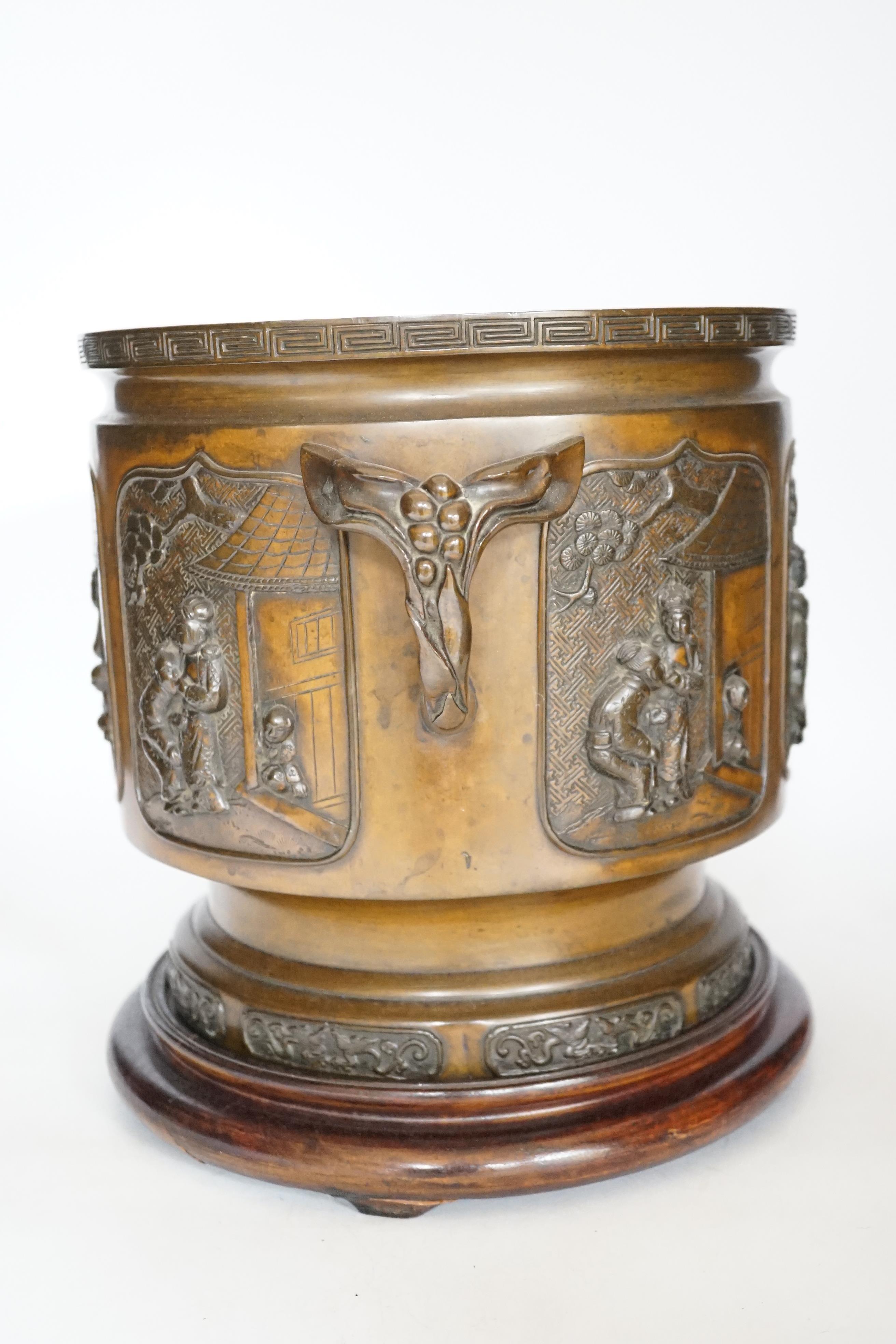 A large 19th century Japanese bronze two handled censer on stand, 28cm high